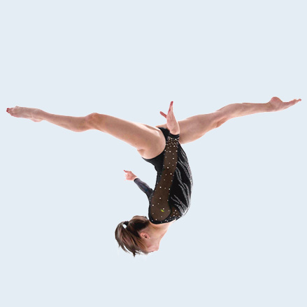Gymnast doing an aerial cartwheel during summer clinic